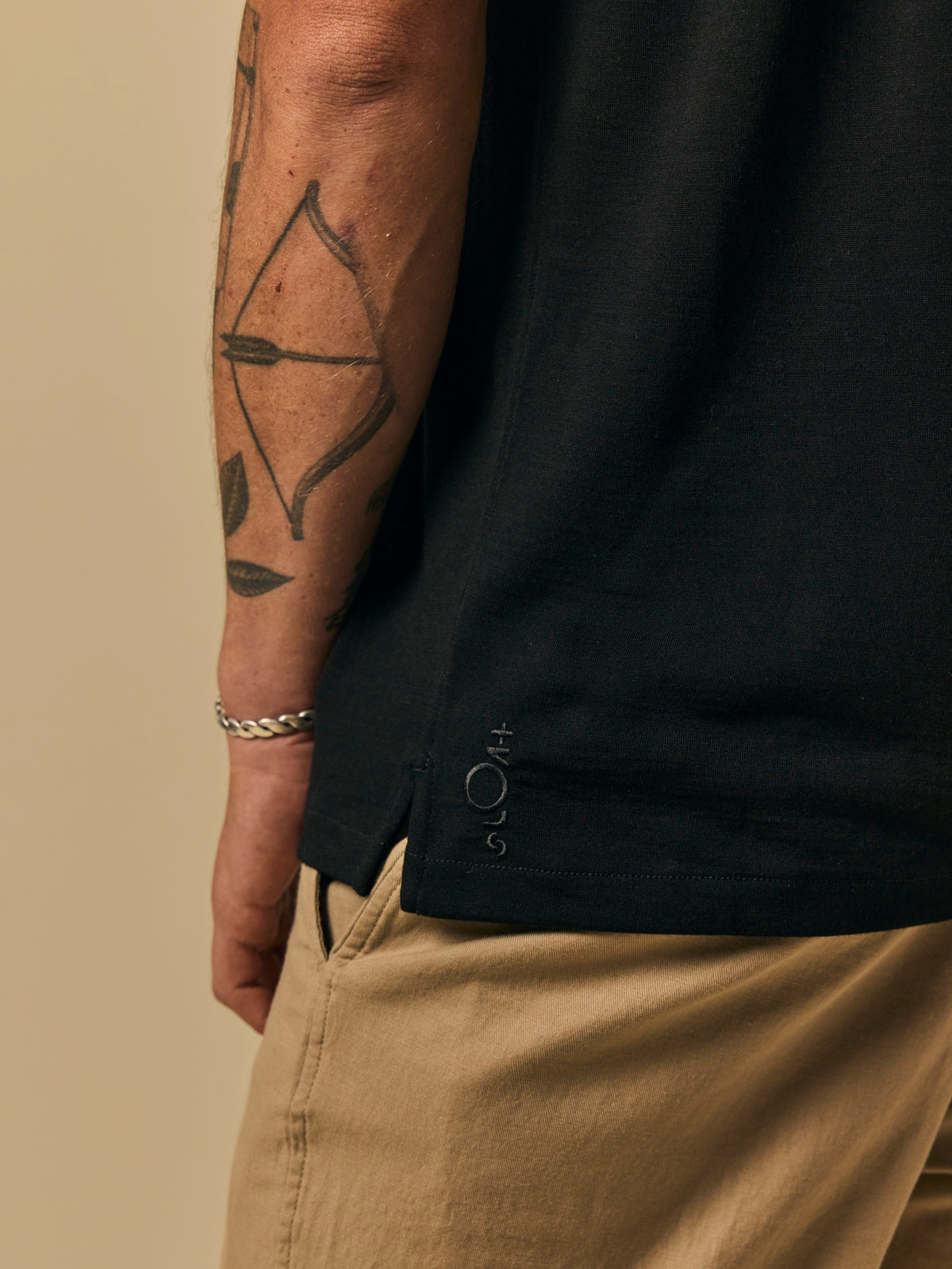 Merino Polo in Black [color:Black]